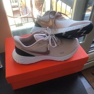 Brand new rose gold Nike runners
